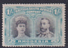 RHODESIA 1910 1/-  DOUBLE HEAD FINE MINT SG 152   #1148